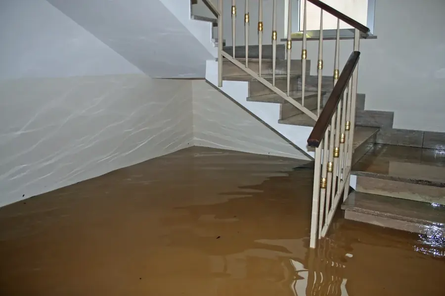 Standing floodwater across a Natick, MA home interior after a water emergency